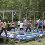 image of a yoga class on the stage