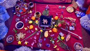 An altar of natural elements on a red cloth