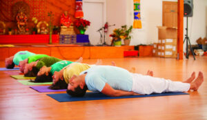 Students do the Fish Pose in the Yoga Hall