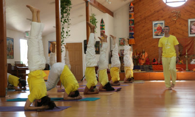 Students practice the headstand