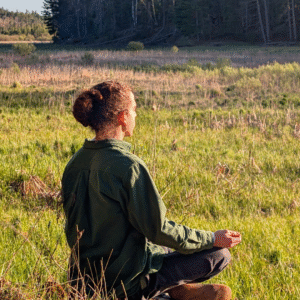 meditating outdoors in nature at Song of the Morning Yoga Retreat