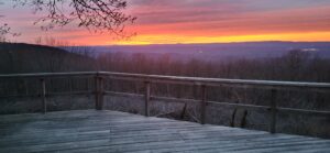 A red and yellow sunset over a purple skyline.