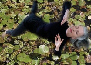 Elaine Colandrea superimposed over water lillies