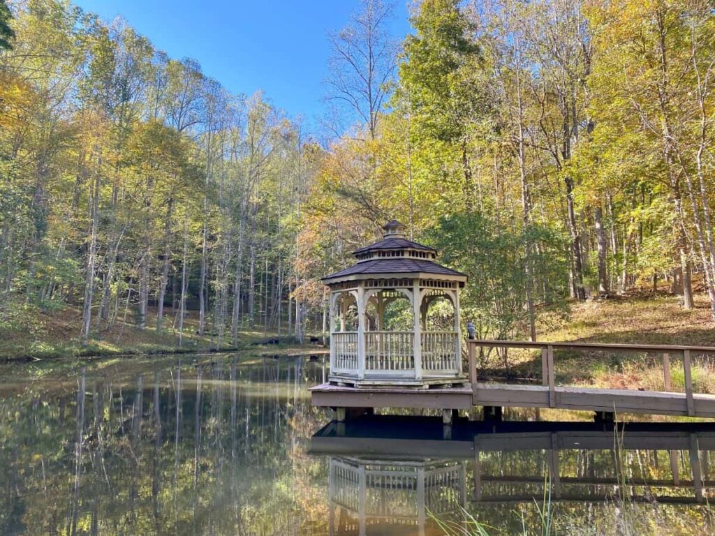 A picture of the pond at The Sanctuary with a beautiful gazebo.